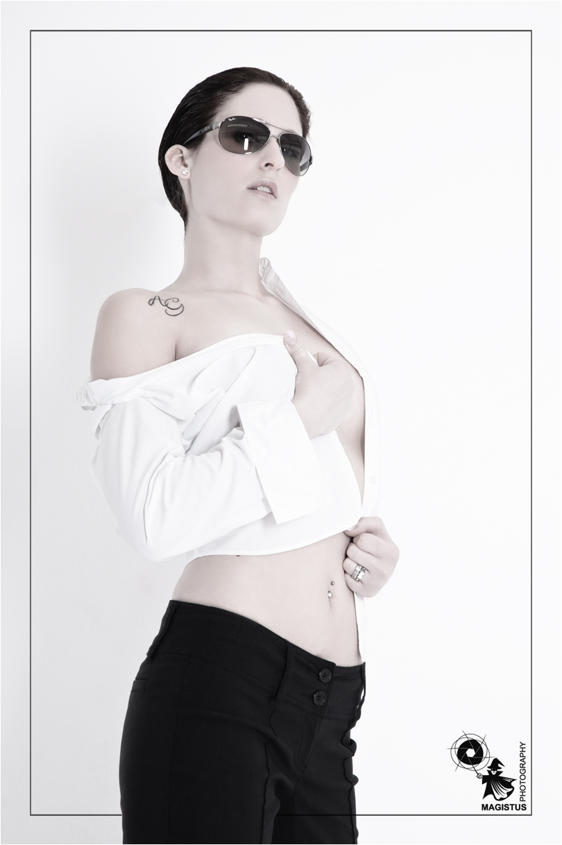 FeMale Fashion - People Photography © by Magistus FeMale Fashion - Super model wearing sunglasses and a white white shirt covering her only barely styled in a male look - Photo © by Magistus