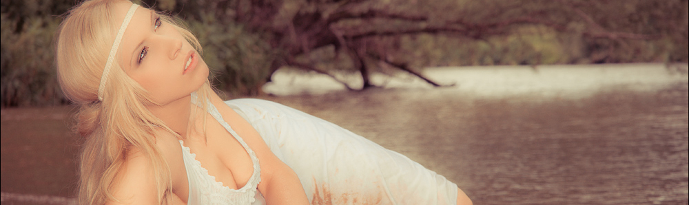 Water Beauty - Beach Photoshooting with wonderful Model posing in the water and beach wearing a wet white Skirt looking into the sky. - © by Magistus