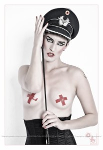 Dominant Beauty - Hot and Sexy Fetish Shooting with beautiful model posing toples with a whip her naked breast only covered by red crosses - © by Magistus