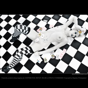 Strip Poker - Nude Art Shooting with a beautiful naked model laying on the floor with poker cards all around her gread hot body and her naked boobs. - © by Magistus
