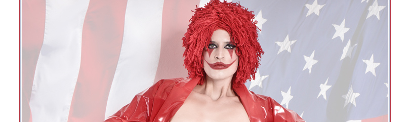 Amercan Fighter - Crazy, sexy and cool Fightergirl shooting with a sexy half naked model styled as clown and boxer with boobs only barely covered by red tape standing in front of an american flag. - © by Magistus