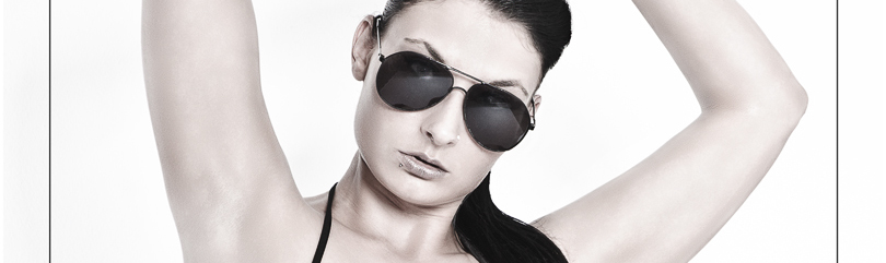 Hot Sexy Babe - Erotic Fightergirl Photoshooting with hot and busty model wearing a very tiny black mini bikini posing tough with sunglasses and weapons - © by Magistus