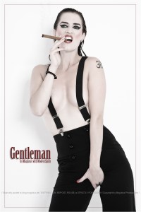 Gentleman - Sexy Girls Male-Fashion with very cool model posing topless with a cigar covering her naked boobs only with a pair of braces. - © by Magistus