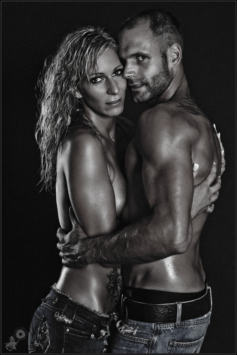 Lovers - Boy-Girl Low-Key Nude Art Shooting - © by Magistus Lovers - Boy-Girl Low-Key Nude Art Shooting with two beautiful topless models posing half naked hugging each other wearing jeans. - © by Magistus