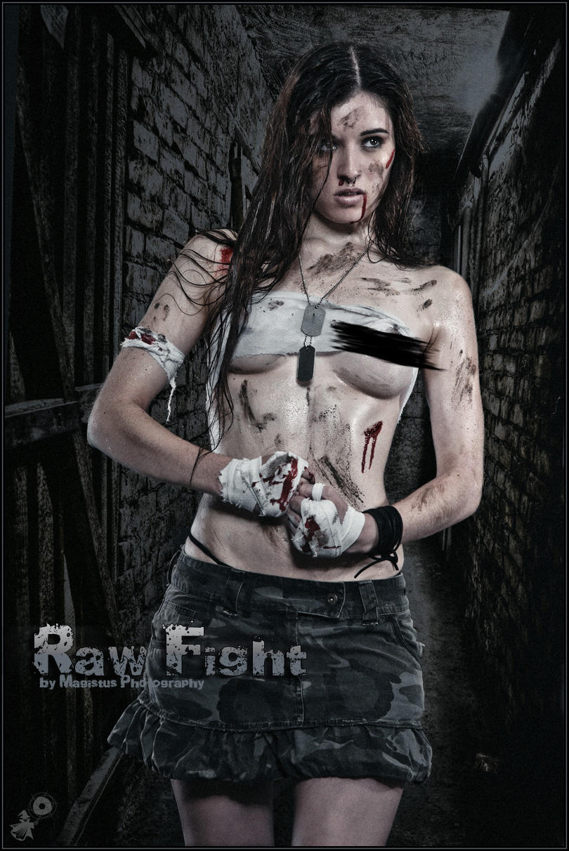 Raw Fight - Erotic Fightergirl Shooting with a beautiful girl posing half naked with dirty on her skin in a dark dungeon wearing a campouflage mini-skirt covering a her beautiful boobs only barely with a pice of dirty cloth showing one naked breast. - © by Magistus
