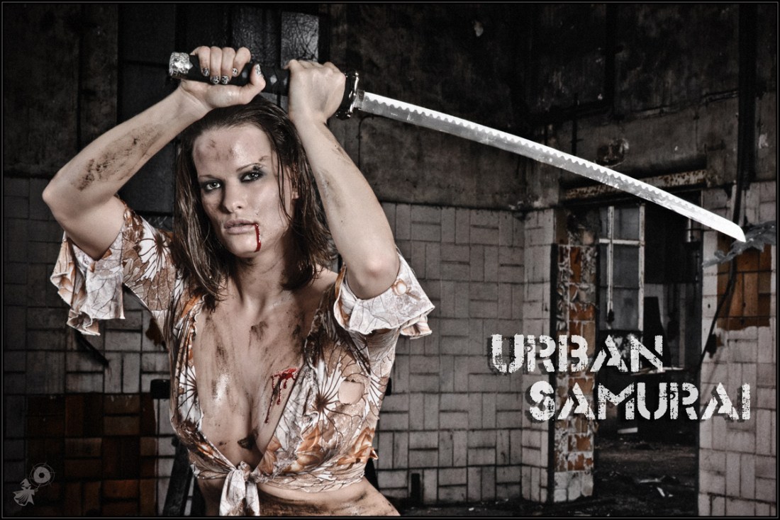 Urban Samurai - Sexy Dirtylook Fightergirl Shooting with a super beautiful busty model with a big cleavage posing with a samurai sword wearing a dirty wide open top. - © by Magistus