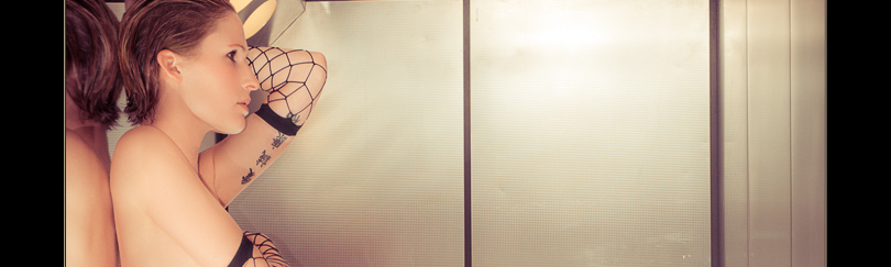 Elevator Beauty - Nude Art OnLocation Shooting with fantastic model posing topless in black lingerie and boots in an elevator showing her tattoos - © by Magistus