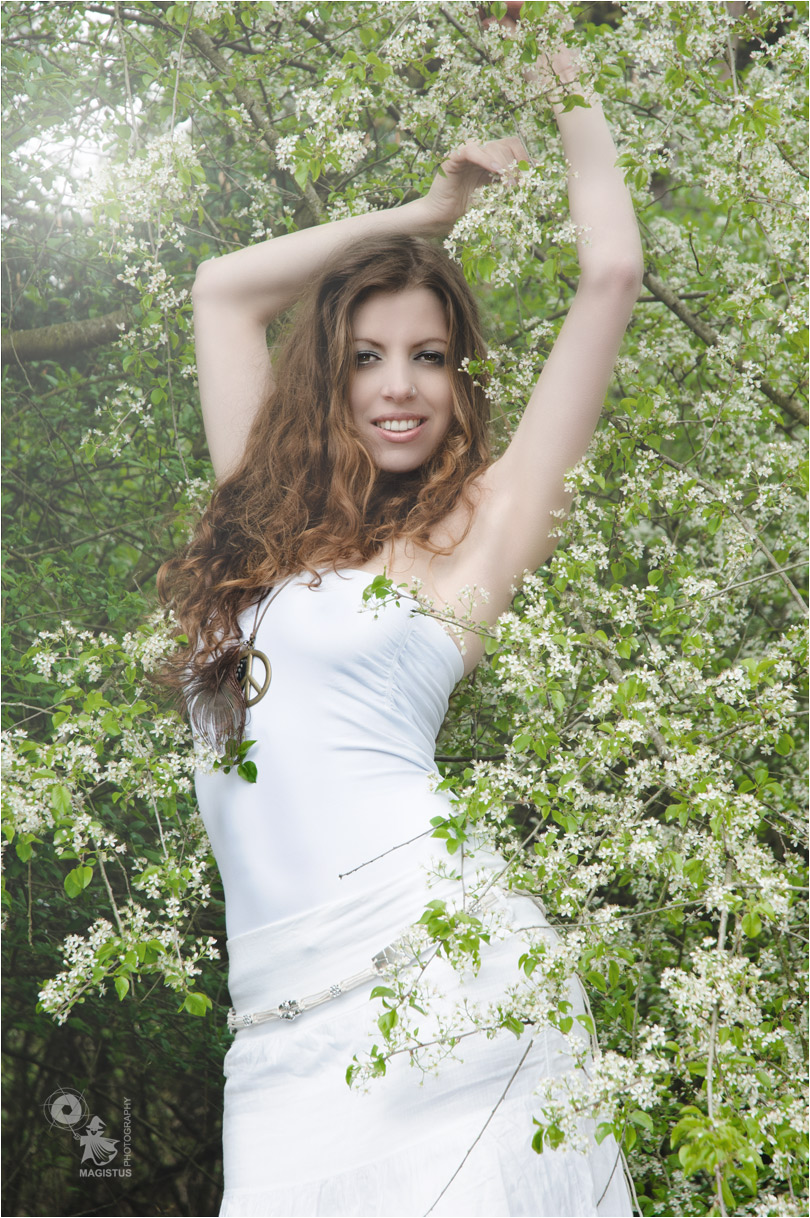Spring Time - Beauty Portrait in Nature with a fantastic model dressed in white posing in flowers - © by Magistus