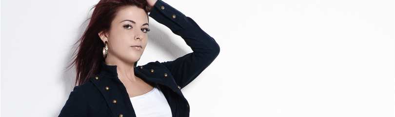 Hotpants - Sexy Jeans Fashion Photoshoot with beautiful model in a short white top and tight jeans shorts posing in front of a white wall - © by Magistus