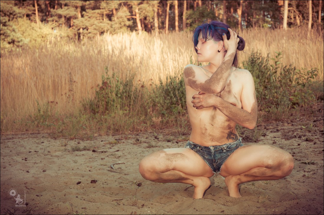 Hotpants Summer - Sexy and Erotic Jeans Hotpants Photoshoot with topless half naked model covered in sand on her wet skin posing wide spread.  - © by Magistus