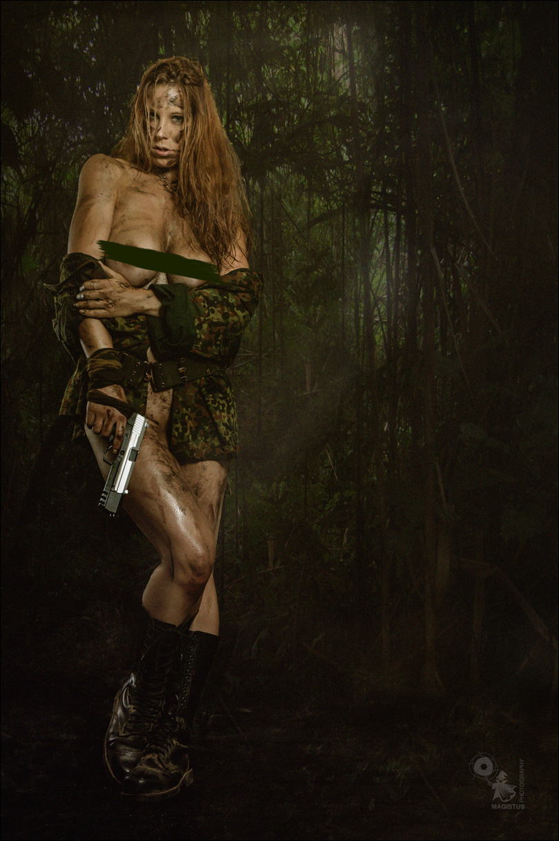 Nude Jungle Fighter - Erotic and Sexy Fightergirl Composing with fantastic model posing half naked in the jungle with a gun in her hand showing off her naked big boobs with mud all over her naked skin. - © by Magistus