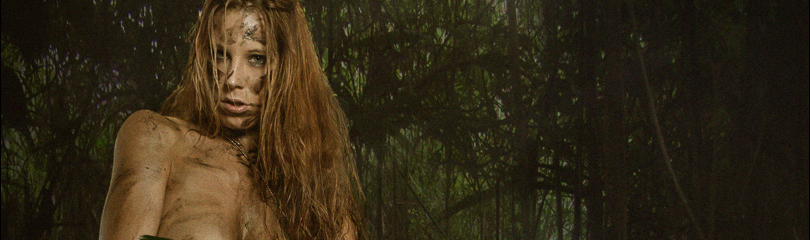 Nude Jungle Fighter - Erotic and Sexy Fightergirl Composing with fantastic model posing half naked in the jungle with a gun in her hand showing off her naked big boobs with mud all over her naked skin. - © by Magistus