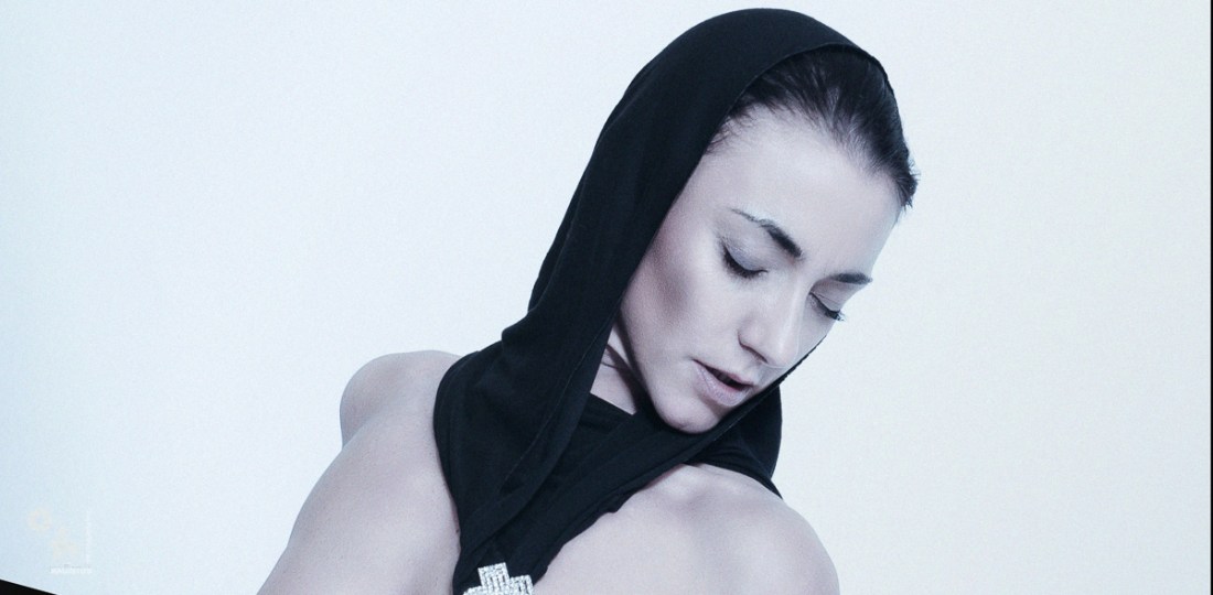 Erotic Mortification - BDSM Fetish Art Picture with fantastic model posing half naked playing with nipple clamps - © by Magistus