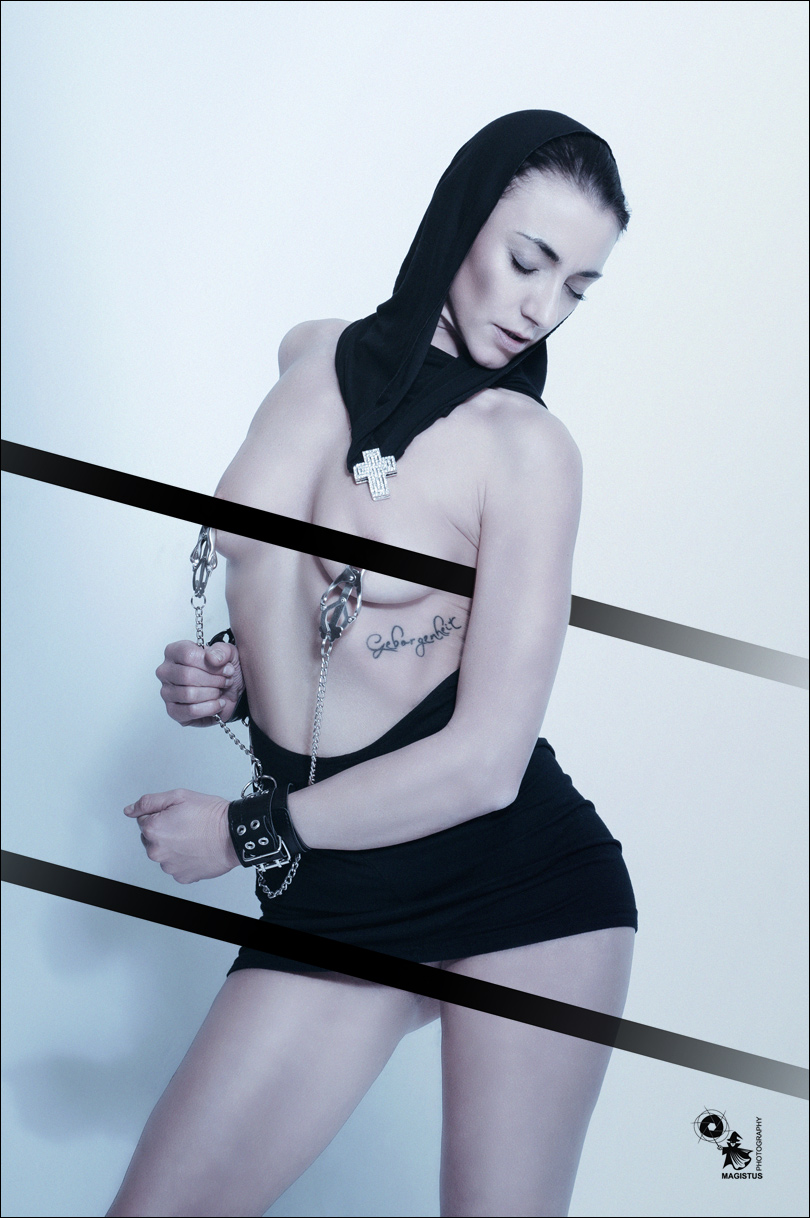 Erotic Mortification - BDSM Fetish Art Picture with fantastic model posing half naked playing with nipple clamps  - © by Magistus