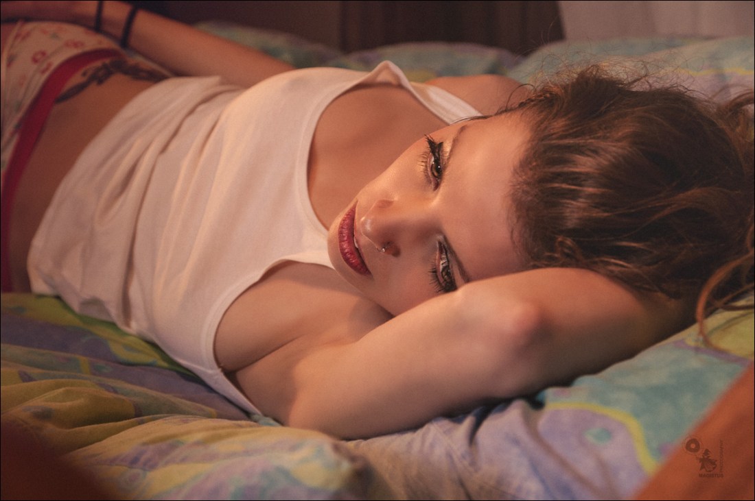 Natural Girls Beauty - Wonderful and sexy Portrait of a beautiful girl in underwear realxing on the bed showing a nice cleavage - © by MagistusFoto