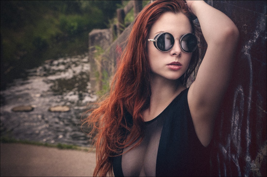 Sun Glasses - super sexy and beautiful closeup portrait auf a redhead beauty with nice cleavage - © by Magistus