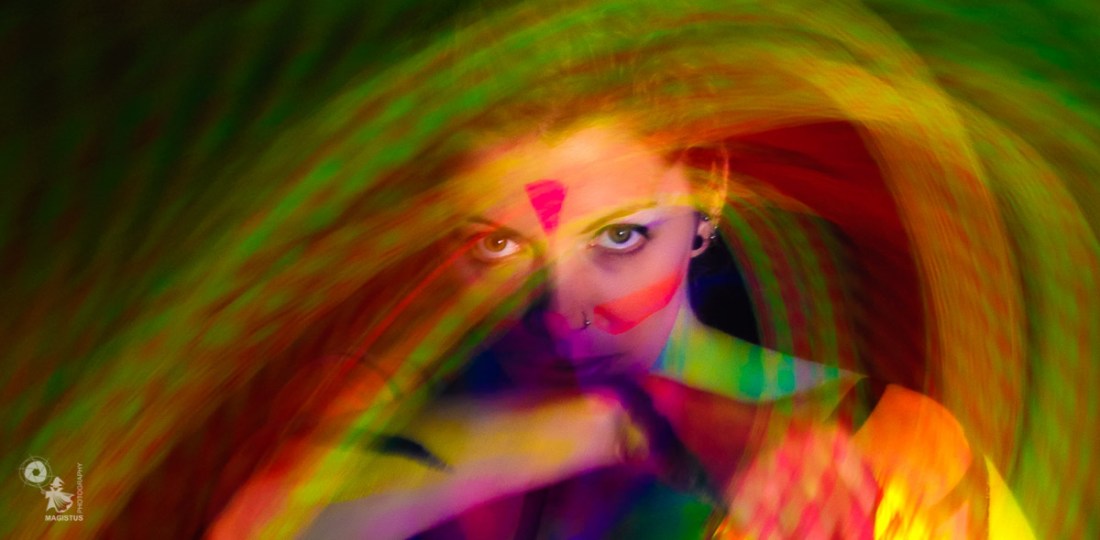 Color Swirl - Bodypainting Art with Long Time Exposure and UV-Light - © by Magistus & Farbtraeume.com