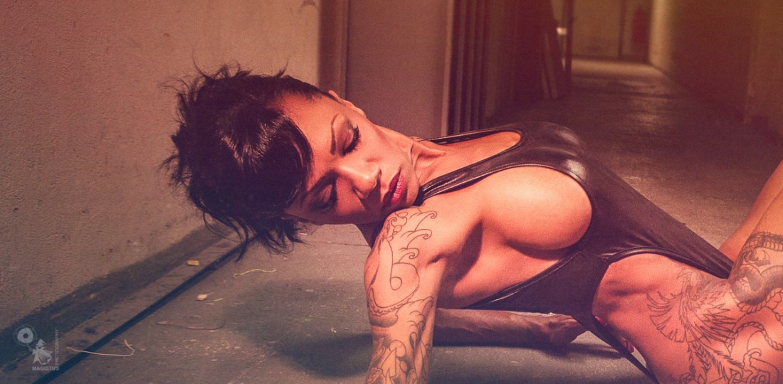 Bombastic - Super hot and sexy black model is posing on the ground wearing a sexy body showing big side boobs - © by Magistus