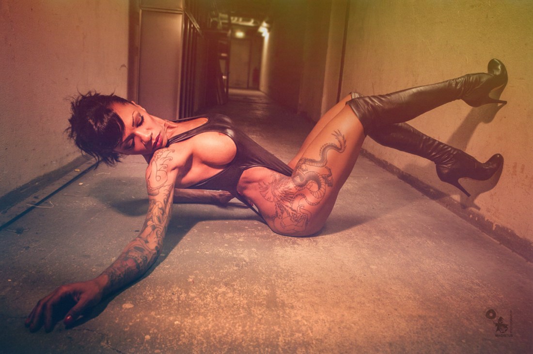 Bombastic - Super hot and sexy black model is posing on the ground wearing a sexy body showing big side boobs - © by Magistus