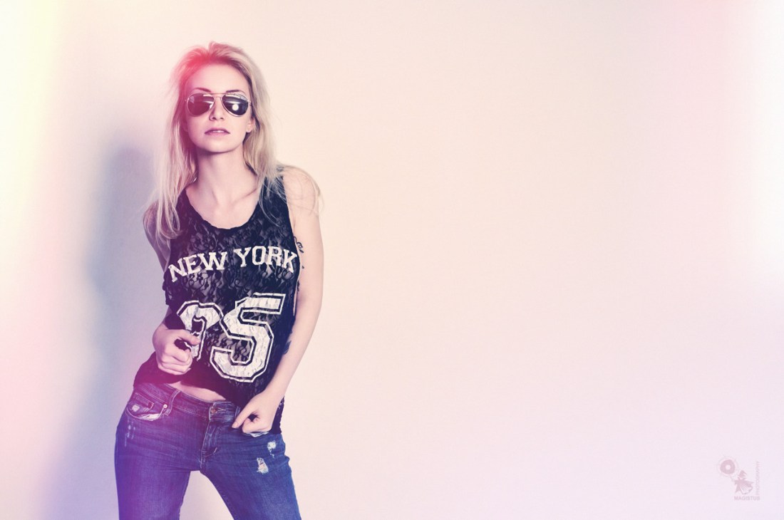New York - Super sexy jeans portrait with hot girl wearing sunglasses and a half transparent seethrough top. - © by Magistus