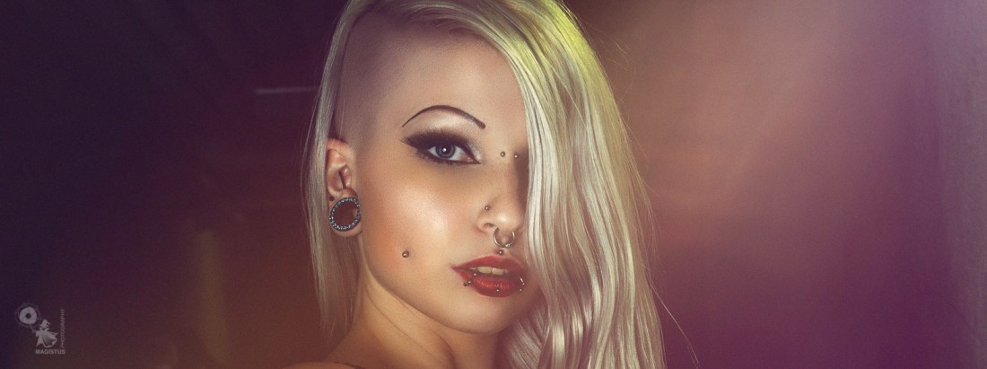 Lilith in the Dark - Super hot and sexy blonde model is posing in the dark presenting her naked pierced tits and tight body. - © by Magistus