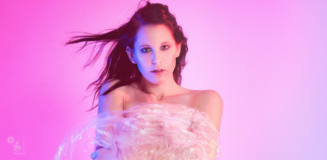 Colorful Wind - Sexy Nude Art Photo with a fantastic busty naked model posing in the wind with her fantastic body covered by transparent foil. - © by Magistus