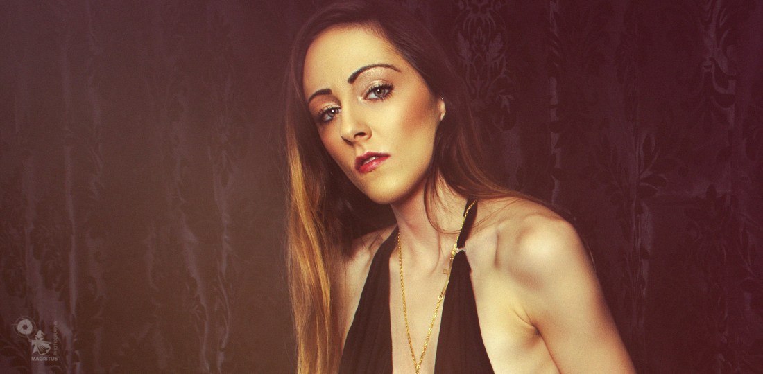 Elegance - Beautiful model is posing in a sexy black and elegant top showing a lot of her tight body. © by Magistus