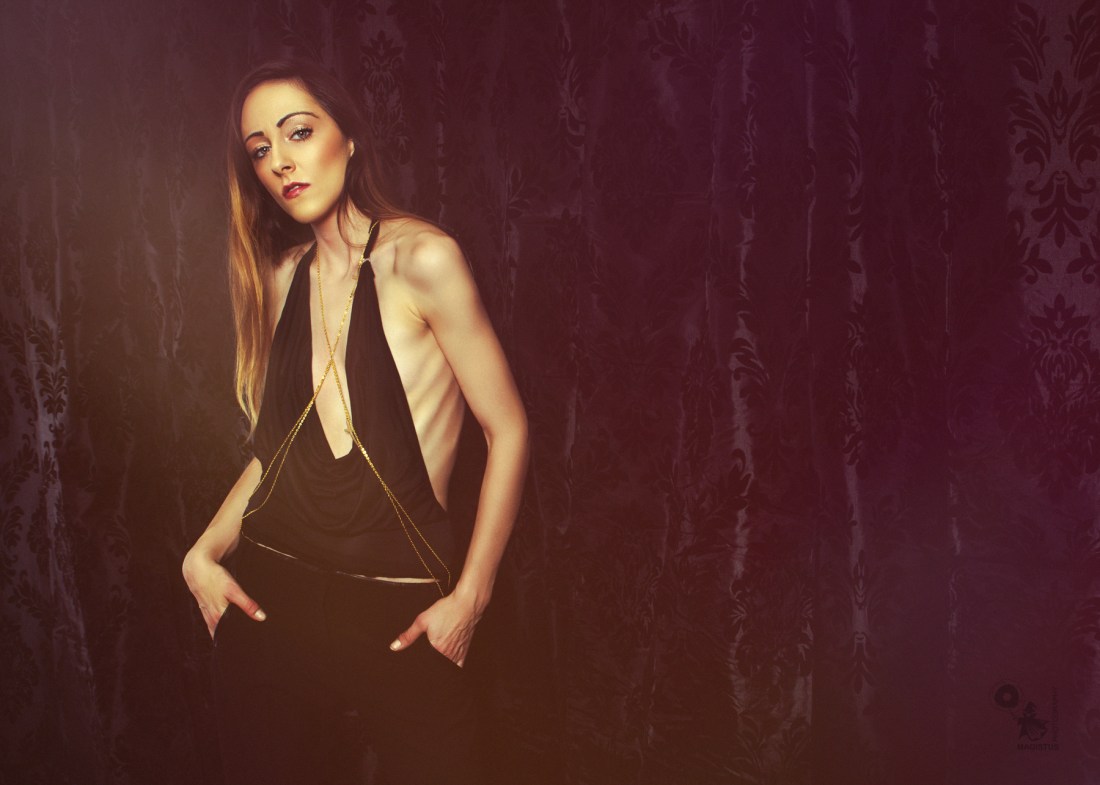 Elegance - Beautiful model is posing in a sexy black and elegant top showing a lot of her tight body. © by Magistus