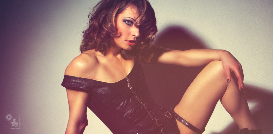 Black Leather - Super sexy erotic model is posing bottomless in a black corsage spreading her legs showing her naked crotch - © by Magistus