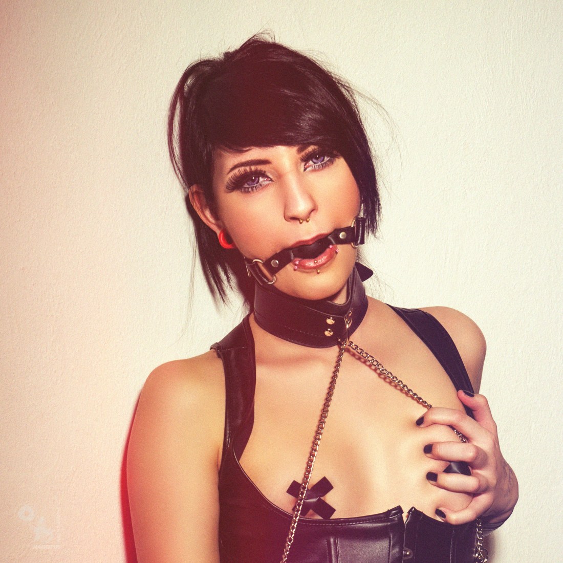 Fetish Girl - Super hot and sexy girl is posing gagged and bound with her naked tits nipple taped wearing a black corsage - © by Magistus