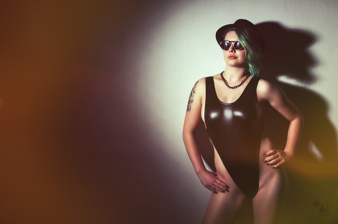 Retro Sun - super hot, sexy and busty girl with sunglasses posing in the spotlight wearing a nice retro swimsuit showing fantastic sideboobs of her big tits - © by Magistus