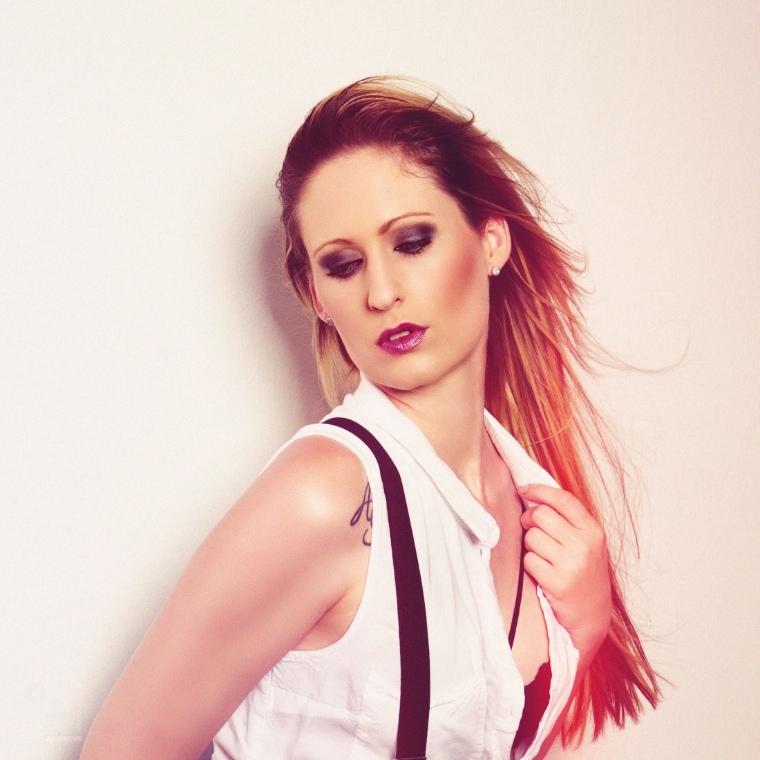 Hot Suspenders - super sexy blonde Beauty is posing with suspenders showing her lingerie bra. - © by Magistus