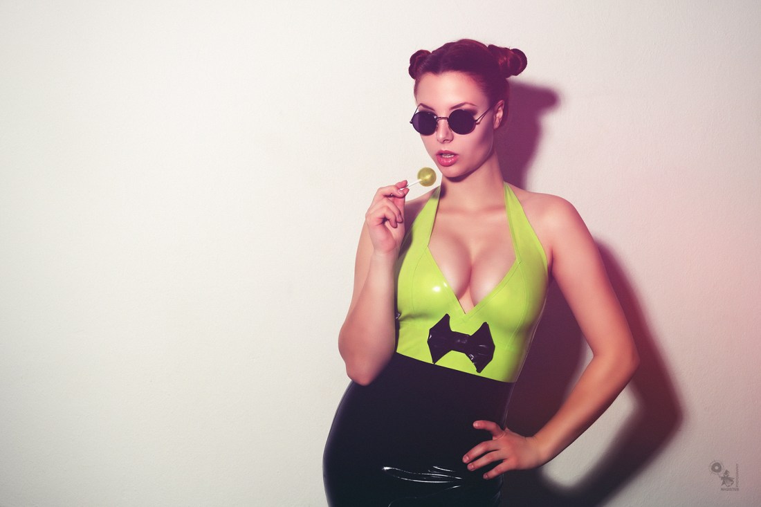 Lolly Fetish - fantastic busty model is posing in a latex dress showing a big cleavage - © by Magistus
