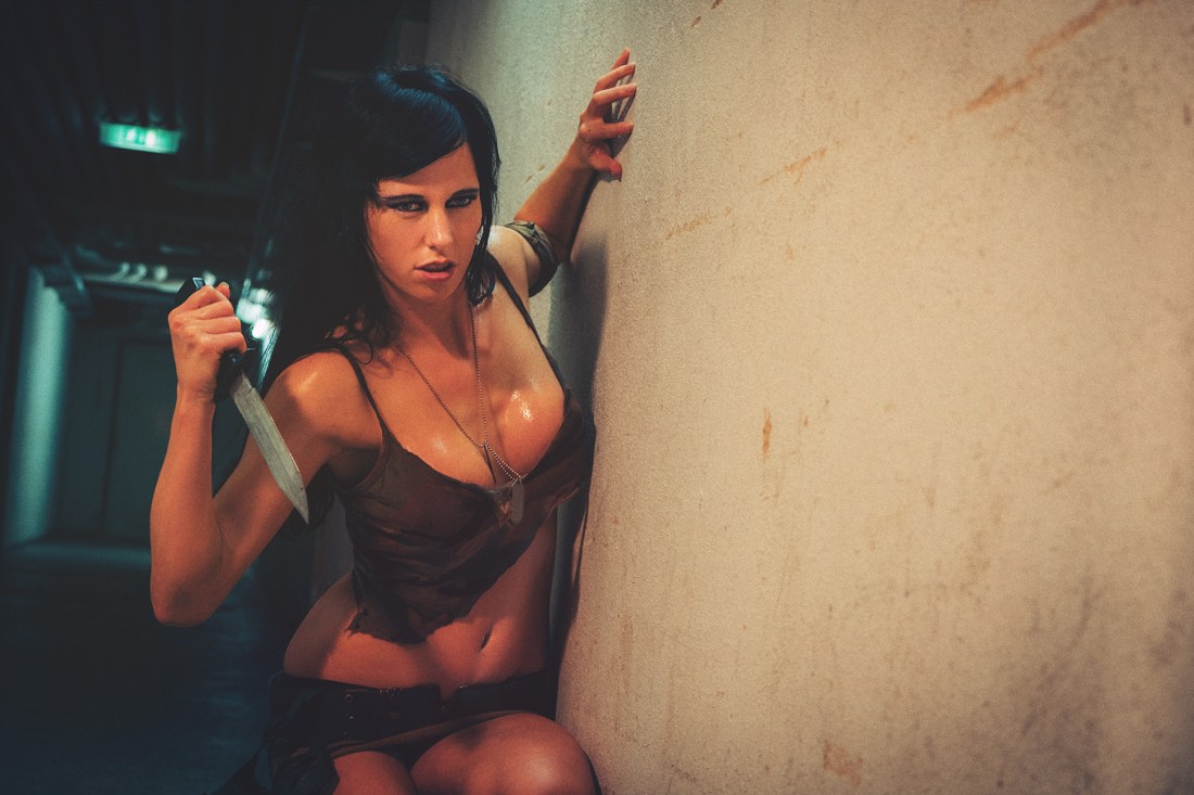 Fighter Girl - super busty and sexy fighter girl is posing with a dagger showing a fantastic cleavage - © by Magistus