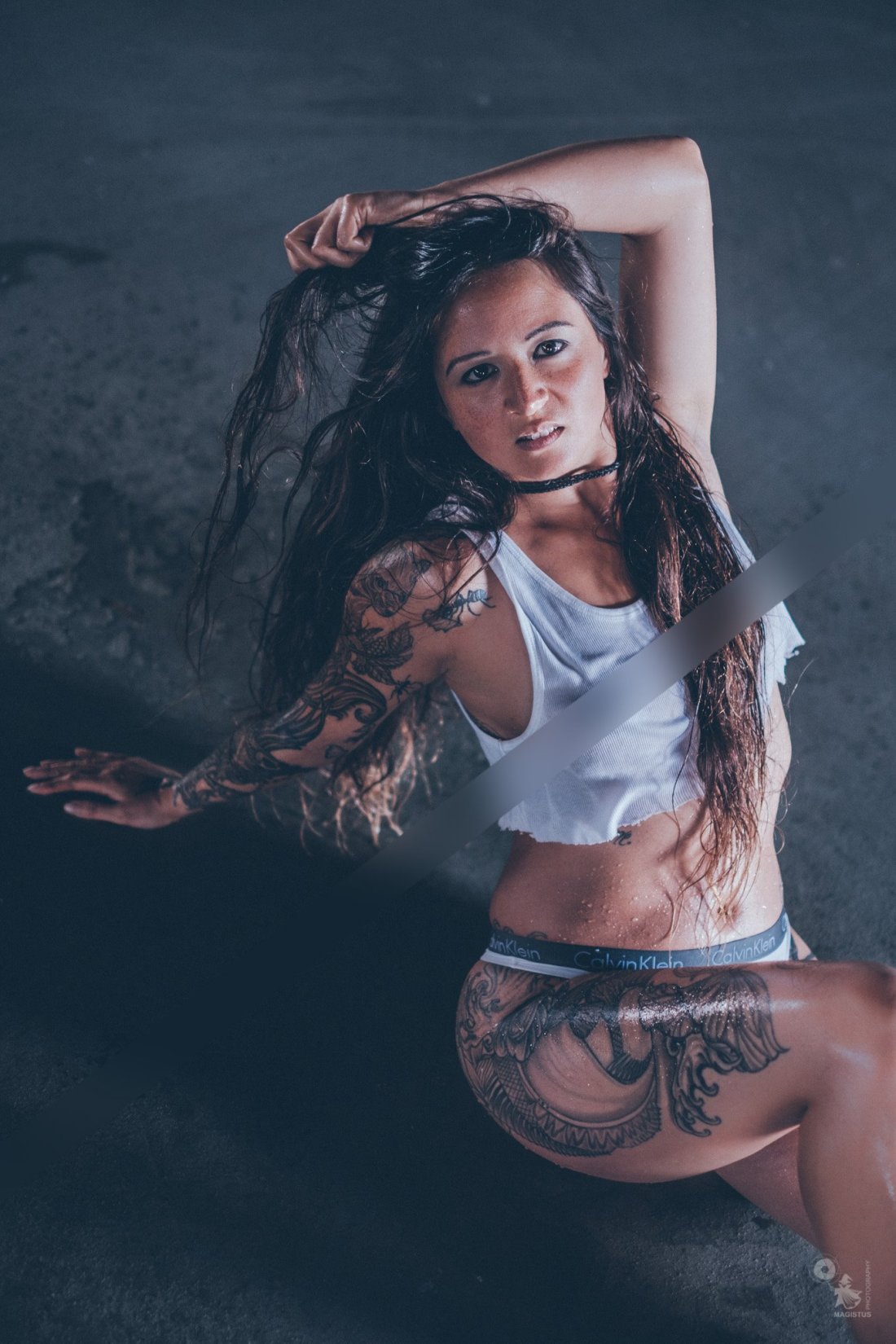 Super sexy tattoo model is posing in underwear and wet t-shirt showing her nipples